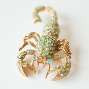 statement 1950s/60s scorpion brooch in gold toned metal w pale green rhinestones